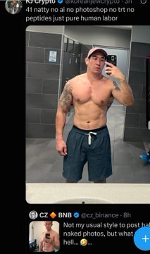A screenshot of a social media post showing a shirtless, muscular man wearing a cap and shorts taking a mirror selfie in a gym locker room, with the caption "41 natty no ai no photoshop no ftt no peptides just pure human labor".