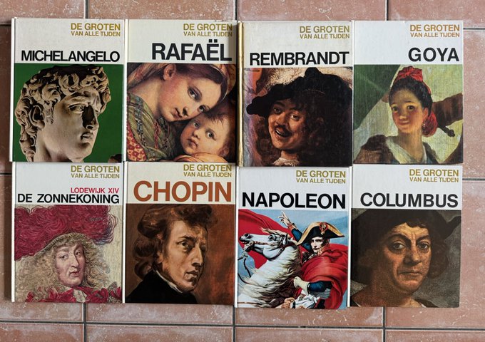 A collection of eight books titled 'DE GROTEN VAN ALLE TIJDEN' featuring historical figures including Michelangelo, Rafaël, Rembrandt, Goya, Lodewijk XIV (De Zonnekoning), Chopin, Napoleon, and Columbus.