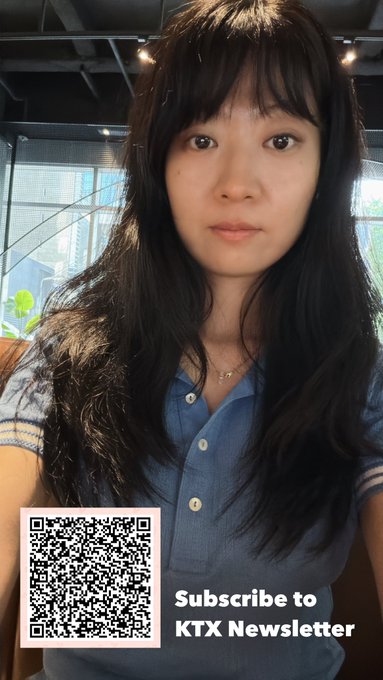 A selfie of an Asian woman with long dark hair wearing a blue button-up shirt, featuring a QR code overlay with the text 'Subscribe to KTX Newsletter'.