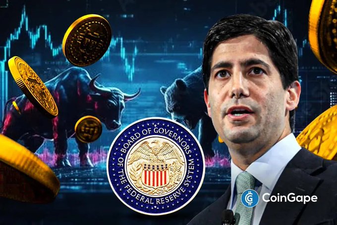 A man speaks alongside the Federal Reserve seal, with financial charts, gold coins, and bull and bear market statues in the background, illustrating the accompanying post about a $10 billion Federal Reserve liquidity injection and its potential impact on Bitcoin ($BTC).