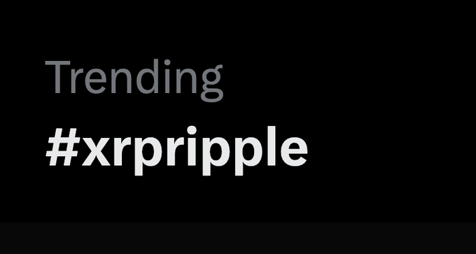 A black graphic displays the word "Trending" in light gray text above the bold hashtag "#xrp ripple" in white, visually reinforcing that the XRP/Ripple hashtag is currently a trending topic.
