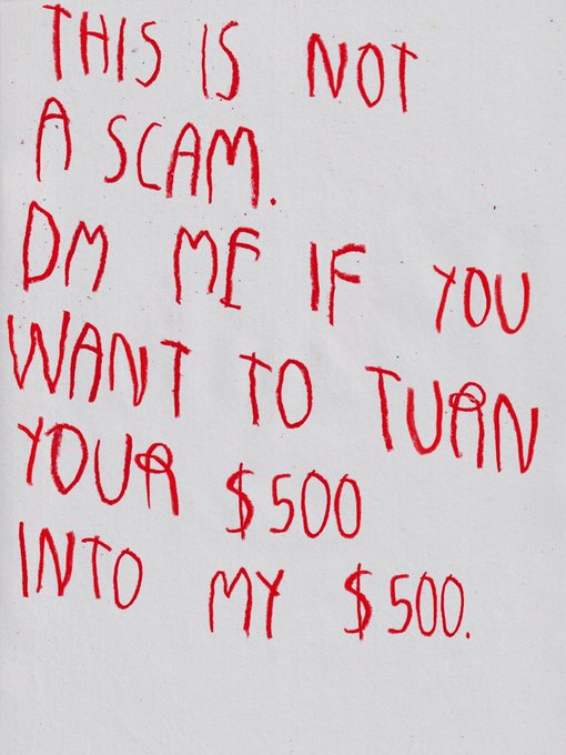 Red handwritten text on a whiteboard reads: 'THIS IS NOT A SCAM. DM ME IF YOU WANT TO TURN YOUR $500 INTO MY $500.'