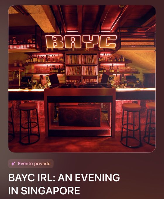 A photo of a bar setup with a neon "BAYC" sign illuminated above the counter, accompanied by the text "BAYC IRL: AN EVENING IN SINGAPORE" and a tag indicating it's a private event. The "BAYC" refers to Bored Ape Yacht Club, tying directly into the post about gathering with the @BoredApeYC community in Singapore ahead of ApeFest.