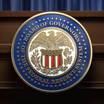 The official seal of the Federal Reserve Board of Governors is displayed, with visible text reading "BOARD OF GOVERNORS" and "OF THE FEDERAL RESERVE SYSTEM." The image relates to the post about rising inflation expectations, as the Federal Reserve is the U.S. central bank responsible for monetary policy aimed at controlling inflation.
