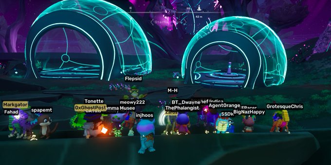 A multiplayer online game scene shows numerous player characters with usernames like 'Fahad', 'Markatior', 'spaemrt', and 'GrotesqueChris' gathered near large glowing blue domed structures in a fantasy environment.