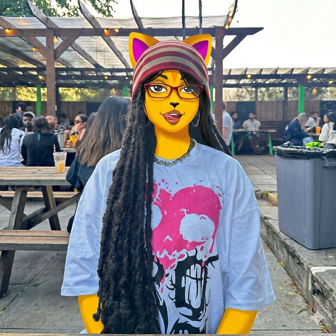 A person with yellow cat-ear face filter, long dreadlocks, and a pink/black graphic t-shirt stands in an outdoor beer garden.
