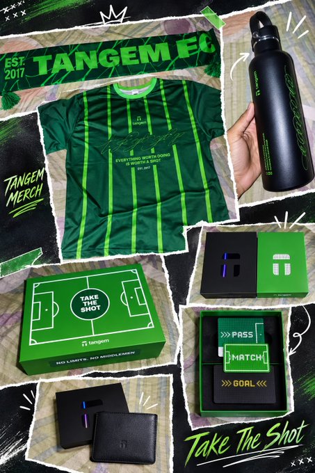 A promotional collage for "TANGEM FC EST. 2017" merchandise, showcasing a green and black striped jersey, a black "tangem" water bottle, and green product boxes labeled "TAKE THE SHOT" with the slogan "EVERYTHING WORTH DOING IS WORTH A SHOT."
