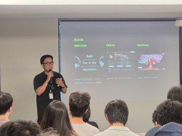 A speaker, identified as @0xjeffai, presents at an event in front of an audience, displaying a slide highlighting NOW Chain, OKX Wallet, and Checkers in his professional setup. The presentation aligns with the post's appreciation for real builders utilizing @dgrid_ai's unified API for diverse projects like trading agents and hackathons.