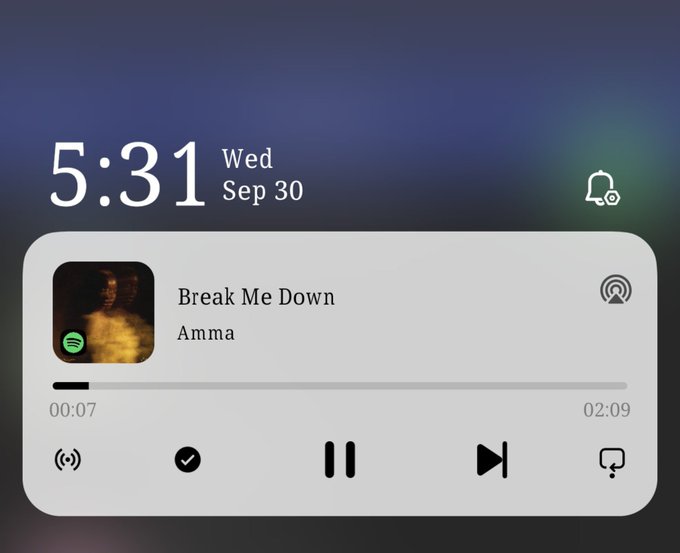A smartphone lock screen showing the time 5:31 on Wednesday, September 30, with Spotify playing 'Break Me Down' by Amma.