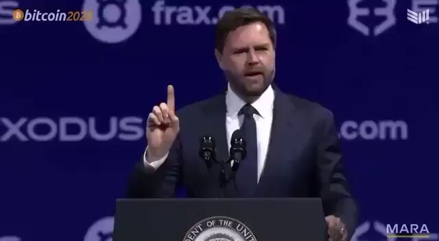 The image shows a man standing at a podium, giving a speech or addressing an audience. The man appears to be wearing a suit and tie, suggesting that he might be a political figure or leader. In the background of the image, there is a banner with the words "BITCOIN20" written on it, indicating that this event took place in the year 2020. The text "vice president jd vance said, we fir ed gary gensler and we’re going to fire everybody like him" suggests that the man's speech might be about addressing a controversial issue or making a bold statement.