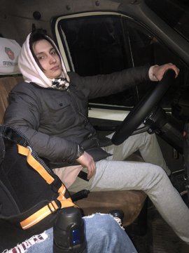 A young man sits in the driver's seat of a van wearing a hood and puffer jacket, holding the steering wheel. The post suggests his journey with Solana has transformed his circumstances, with the vehicle possibly symbolizing the tangible success or mobility he's achieved through his involvement in the Solana ecosystem.