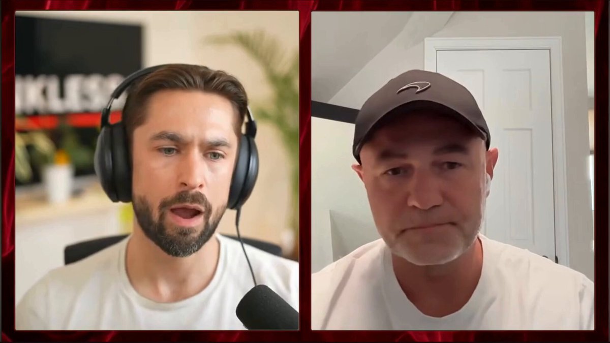 The image shows two men wearing headphones, with a microphone positioned between them. They appear to be having a conversation or participating in an online meeting. The background features a red curtain that adds color to the scene.