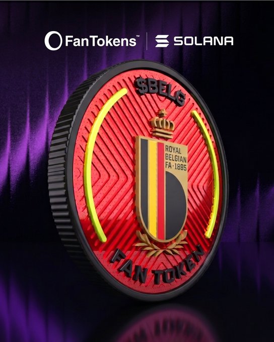 The image features a coin with a red background, black border, and yellow center that displays "SOLANA" written in white letters. The coin also has a shield design featuring a yellow and black pattern, with a crown at its center. Below this shield is a gold emblem with the words "BELG" written on it. In the bottom right corner of the image, there's text that reads "$BELG is officially live on @solana".