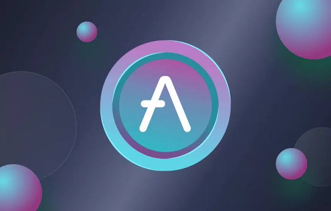 A circular logo with a stylized white 'A' symbol set against a teal and pink gradient background, surrounded by floating gradient spheres.