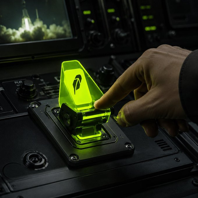 A hand presses a glowing neon-green coin-shaped control on a futuristic console. The fiery visual reinforces the post’s question: “Which coin has the strongest 100x potential? 🔥”
