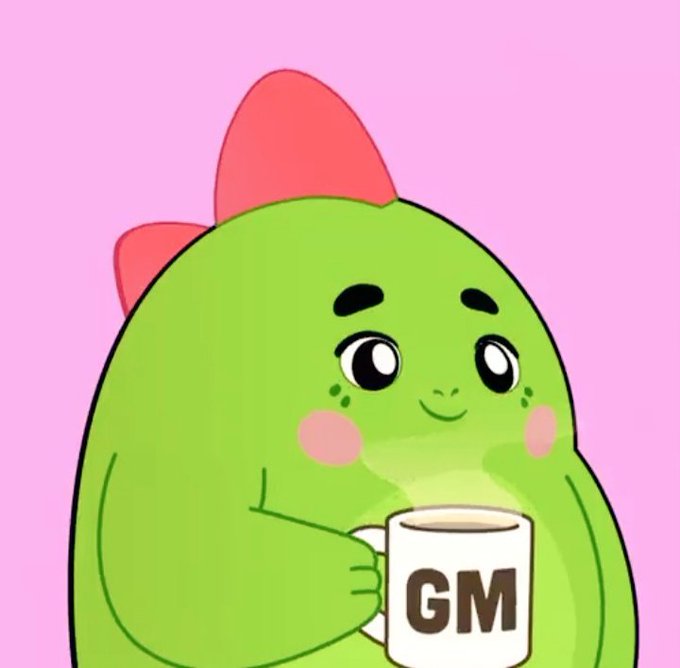 A cute green cartoon dinosaur with a red bow on its head smiles while holding a white mug that says "GM" against a pink background.
