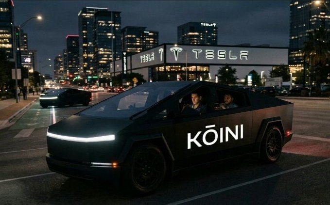 A digital rendering shows a black Tesla Cybertruck driving on a city street at night in front of a Tesla showroom, with 'KŌINI' written on the door and two passengers inside.