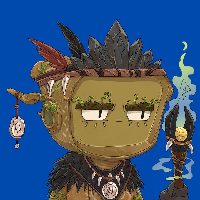 A cartoon illustration of a square-faced tribal or shaman character with a stone crown, feather accessories, and a tribal necklace, holding a talisman, set against a solid blue background.