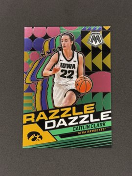 A basketball trading card featuring Caitlin Clark of the Iowa Hawkeyes (#22) with a 'Razzle Dazzle' insert design and colorful pop-art background.