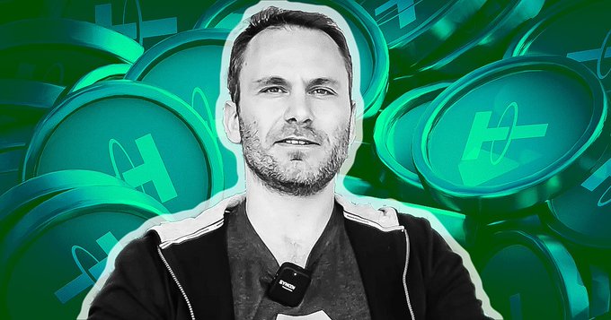 A black-and-white photo of a man with a microphone clipped to his shirt is overlaid on a green background filled with multiple HedgeUp ($HGUP) cryptocurrency logos.