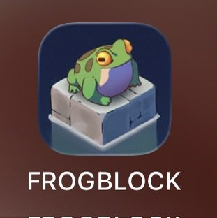 An app icon featuring a green cartoon frog sitting on a blue block, labeled 'FROGBLOCK' on a brown background.