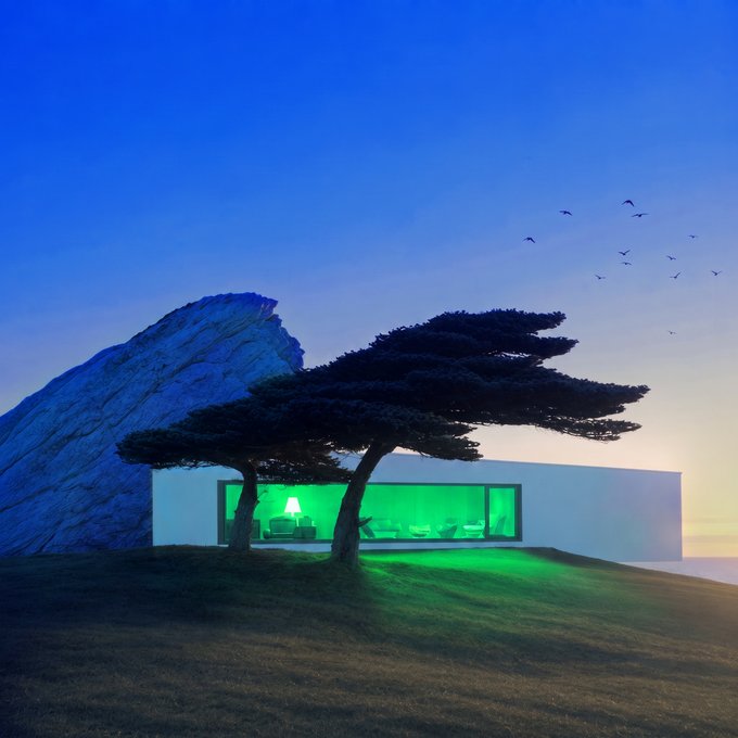 A modern minimalist home glows with vivid green light from its large windows, nestled beside a rocky cliff and silhouetted tree at dusk. The eerie green illumination perfectly matches the post's "Woke up to green GM 💙" message, suggesting a surreal or themed wake-up moment.