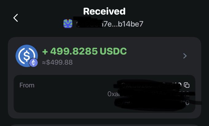 A screenshot of a crypto wallet 'Received' transaction showing +499.8285 USDC (~$499.88) received, with the sender's address redacted with black marker.