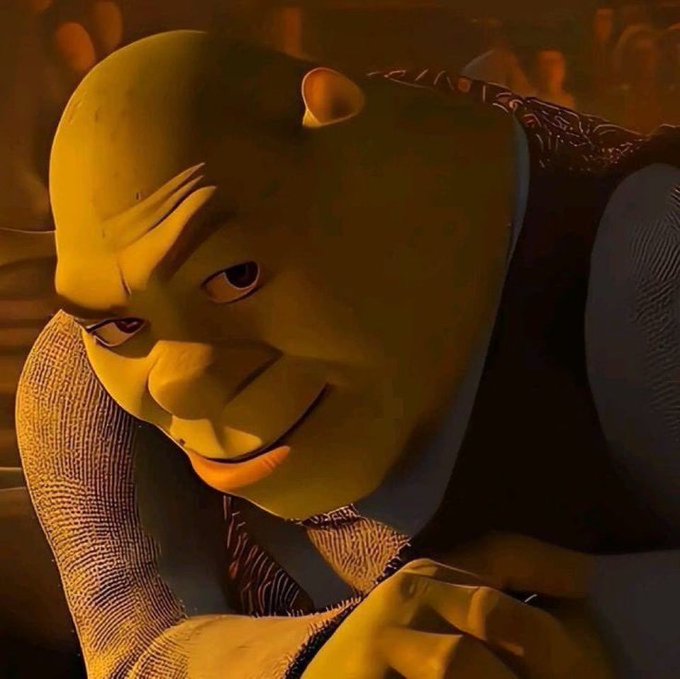 A 3D-rendered green ogre character with a sly smile leans on his arm in a warmly lit setting.