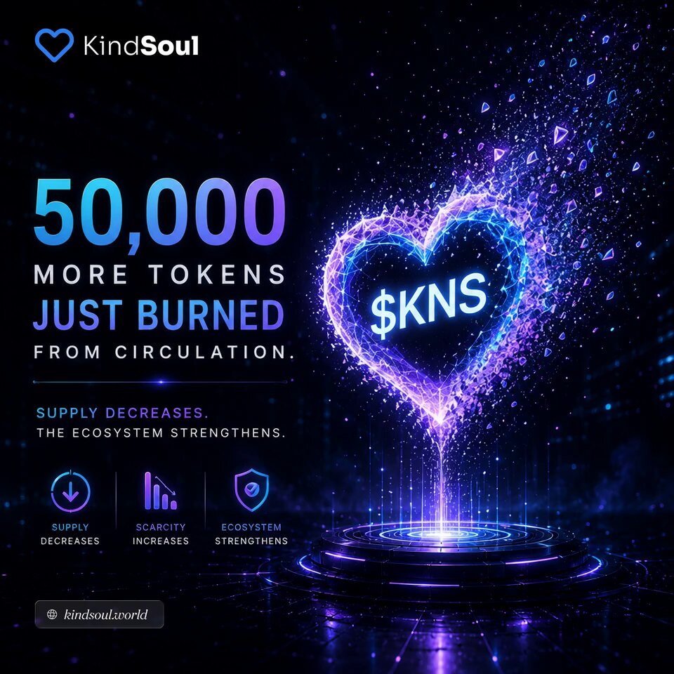 The image features a vibrant purple heart floating above a dark blue base, with the words "kind Soul" displayed prominently at the top and "50,000 tokens just burned from circulation." The heart-shaped design suggests an association with a currency or token. The background is described as a "black sky," which contrasts with the colorful heart in the foreground. Additionally, there are text elements that provide information about trading activities and the impact of burning tokens on supply, including statistics about the strength of the community's ecosystem.
