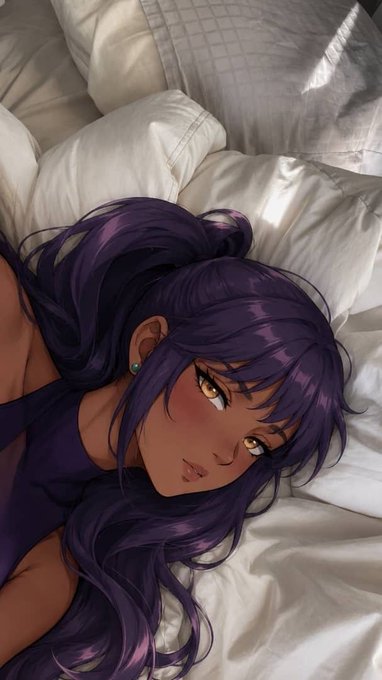 An anime-style illustration of a girl with long dark purple hair, amber eyes, and a small turquoise earring lying on white pillows, appearing flushed.