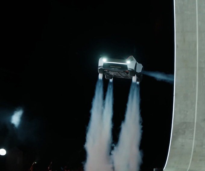 A futuristic flying car hovering in the night sky, propelling itself with downward thrusters that create smoke plumes.