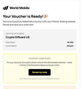 A World Mobile notification screen showing a successfully redeemed voucher for a 'Crypto Giftcard US' worth 25 USD, with a 'Reveal my code' button.