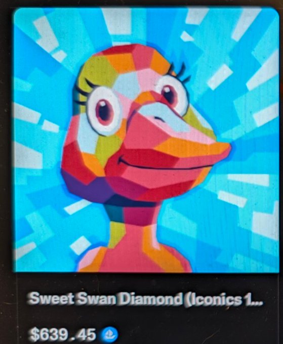 A digital trading card or NFT titled 'Sweet Swan Diamond (Iconics 1...)' featuring a colorful, geometric illustration of a pink bird character with large eyes, priced at $639.45.