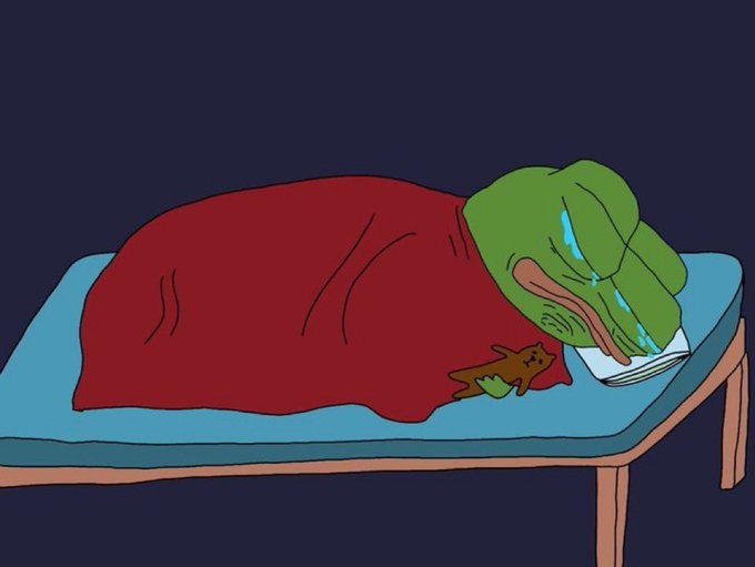 A cartoon illustration of a green Pepe the Frog character sleeping in a bed under a red blanket with a small teddy bear, crying blue tears onto a pillow.