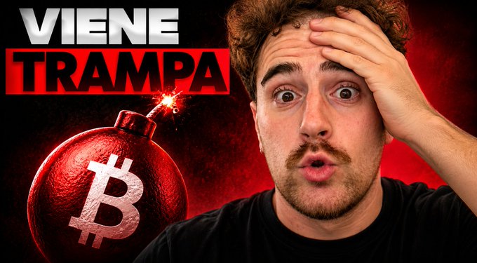 A shocked-looking man holds his head next to a red Bitcoin bomb illustration with the Spanish text 'VIENE TRAMPA' (Trap is Coming).