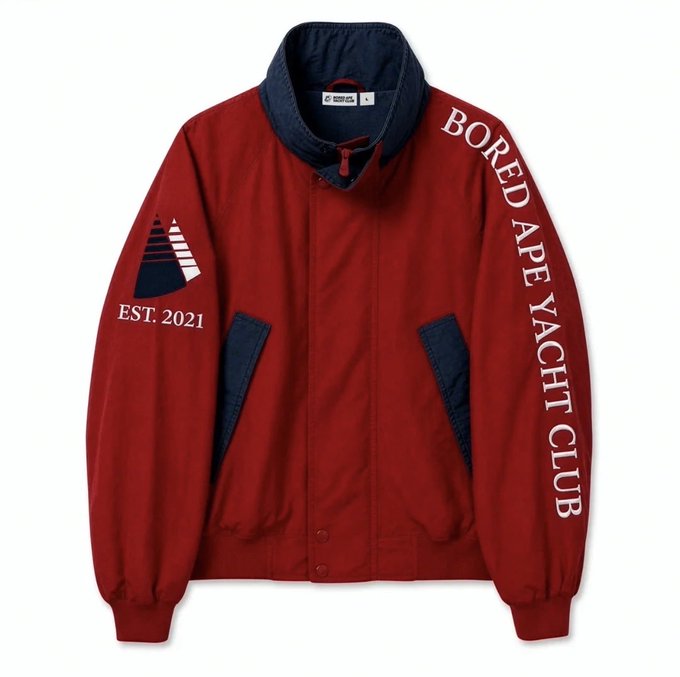 A red and navy blue Harrington-style jacket displayed flat, with "BORED APE YACHT CLUB" printed down the right sleeve and a sailboat logo with "EST. 2021" on the left sleeve.