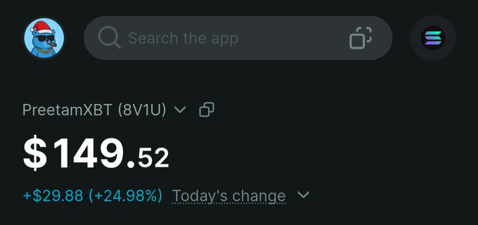 The screenshot displays a trading app interface showing a portfolio named "PreetamXBT (8V1U)" with a current value of $149.52 and a daily gain of +$29.88 (+24.98%). The festive Santa-hat-wearing shark avatar and large daily gain suggest the user is showcasing impressive trading results to incentivize follows and notifications, as requested.
