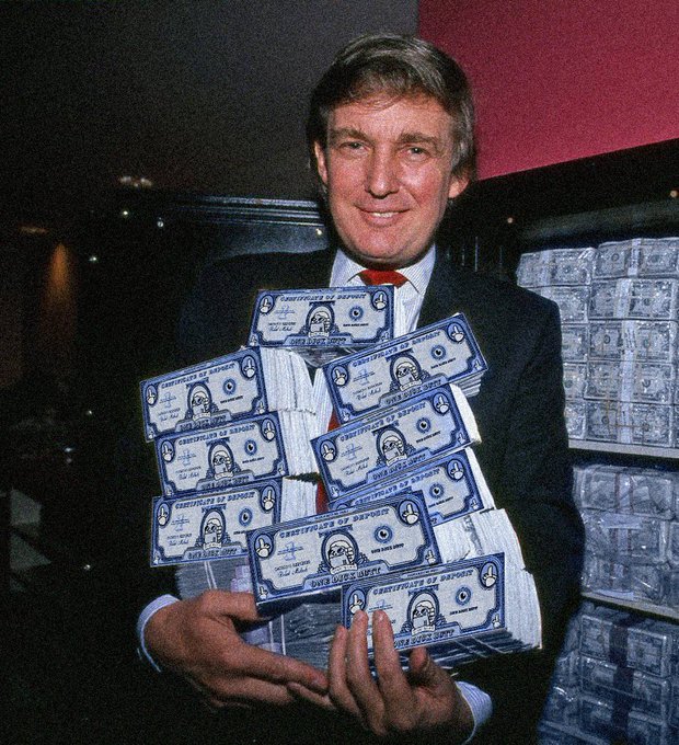 A man in a suit holds up several stacks of 'Certificates of Deposit' from 'Home Fed. Svgs.', with more stacks visible behind him.