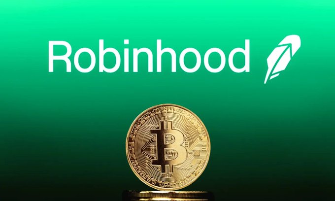 The Robinhood logo on a green background with a physical Bitcoin coin displayed in front of it.