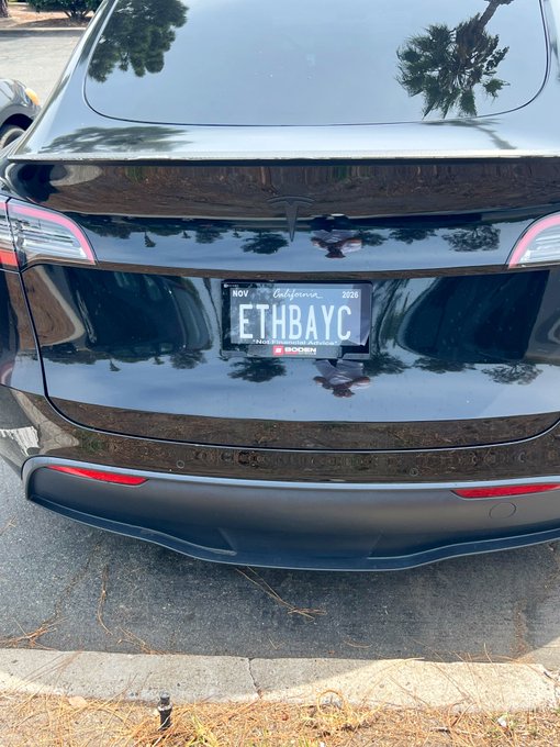 The rear of a black Tesla Model 3/Y with a California license plate reading 'ETHBAYC' mounted in a Boken frame.