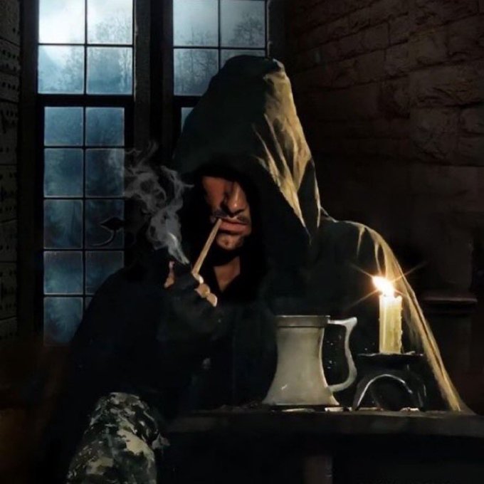 A hooded figure smokes a cigarette by candlelight in a medieval tavern setting, wearing modern camouflage pants that clash with the historical aesthetic. The mysterious, shadowy pose evokes the SEC and CFTC lurking in wait, as the post suggests, for the Clarity Act to collapse while they prepare to act.
