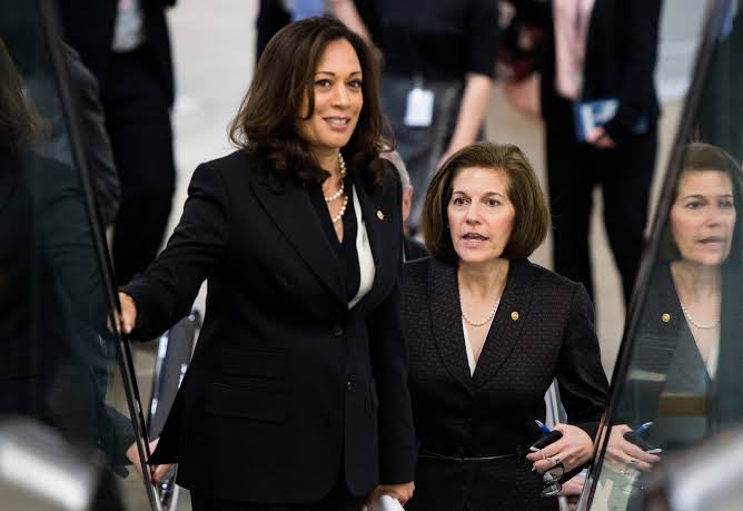 Two women in professional attire, one resembling Senator Kamala Harris, walk together through what appears to be a governmental building, with the woman on the right holding documents and a water bottle. The image does not contain any visible text or numbers that relate to the post about Democratic votes, though the political context suggests it may have been shared to accompany a call for legislative action.