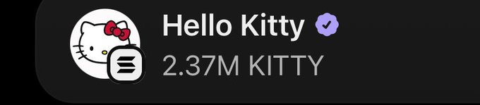 A digital badge or profile showing the Hello Kitty character icon with a verified checkmark, displaying the username 'Hello Kitty' and '2.37M KITTY'.