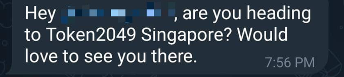 A screenshot of a text message that reads, 'Hey [redacted], are you heading to Token2049 Singapore? Would love to see you there,' sent at 7:56 PM.