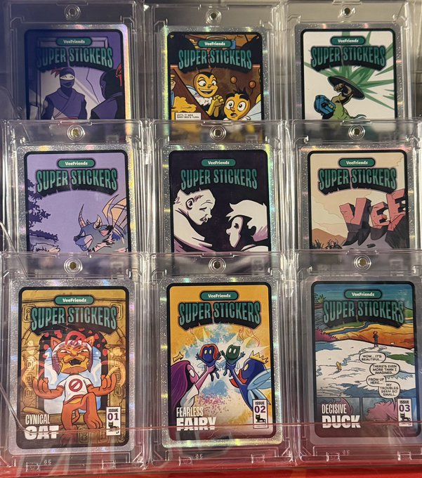 A collection of nine 'Super Stickers' from VeVeFriends trading cards displayed in protective cases, featuring characters like Cynical Cat, Fearless Fairy, and Decisive Duck.