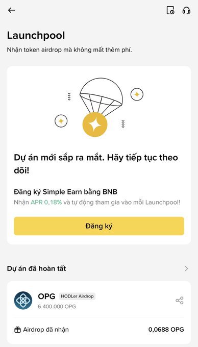 A mobile app screenshot for Binance's 'Launchpool' feature, showing a Vietnamese interface with an illustration of a coin descending by parachute, a 'Đăng ký' (Register) button for Simple Earn using BNB, and a completed project listing for OPG HODLer Airdrop.
