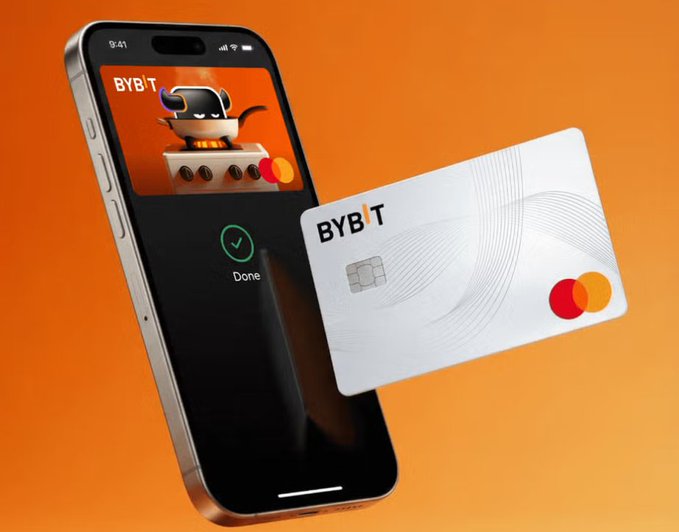 The image shows a smartphone displaying the Bybit app with a confirmation checkmark alongside a white Bybit Mastercard featuring the Mastercard logo. This visual directly illustrates the post's promotion of the Bybit Card, which allows users to spend crypto in everyday life while earning deposit bonuses, cashback rewards, and trading fee discounts.