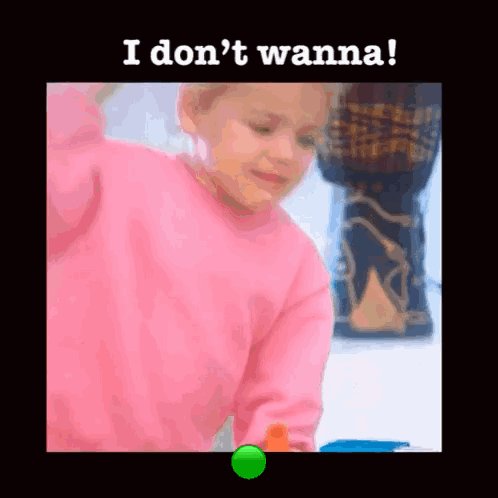 The image features a young girl wearing a pink sweater, sitting at a table with an orange toy in front of her. A green button can be seen near the bottom right corner of the frame. The background appears to be black, which contrasts with the bright colors of the girl's outfit and the toy she is playing with. The image also contains text that reads "I don't wanna" at the top left corner and "Quant fable sounds cinematic ngl" in the bottom right corner.
