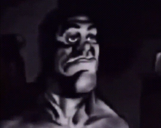 A grainy black-and-white close-up still of a monstrous gorilla-like creature with a menacing expression, appearing to be vintage B-movie footage.