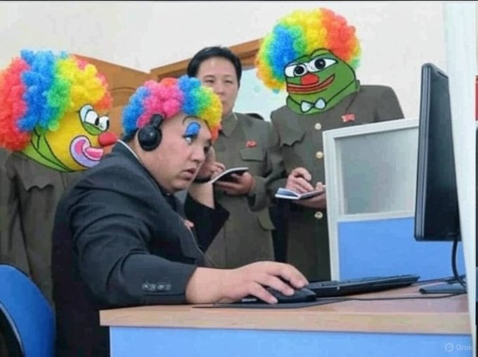 A meme-style image showing men in military-style uniforms looking at a computer, with two of them having their faces replaced by clown masks wearing colorful rainbow afro wigs.